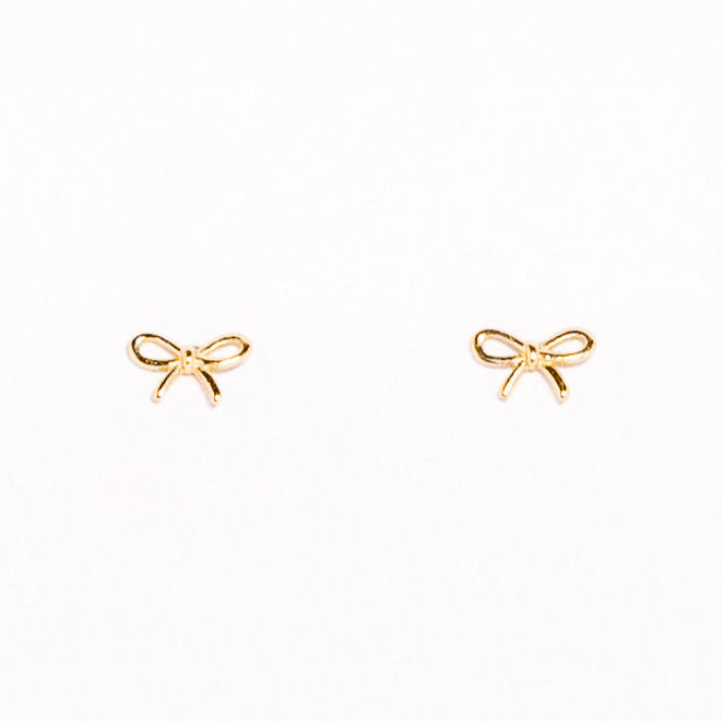 Gold bow-shaped earrings on a white background