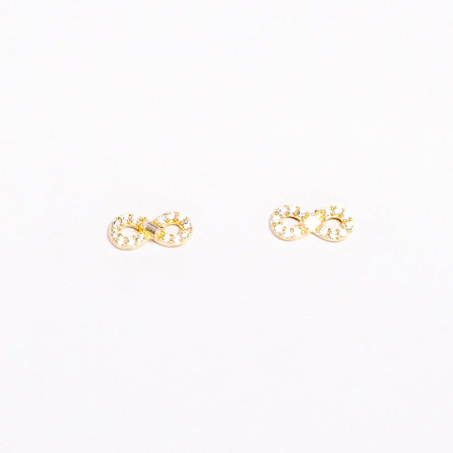 Gold earrings on a white background