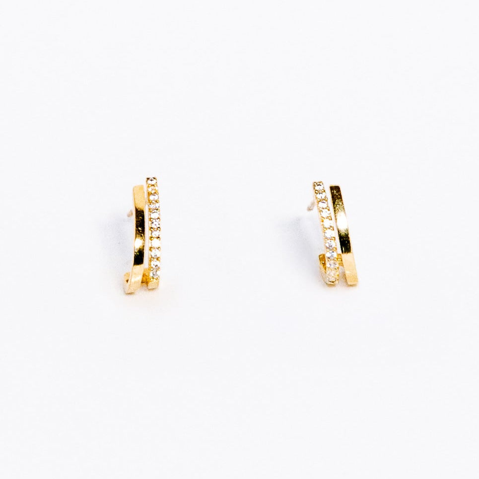 Gold hoop earrings on a white background
