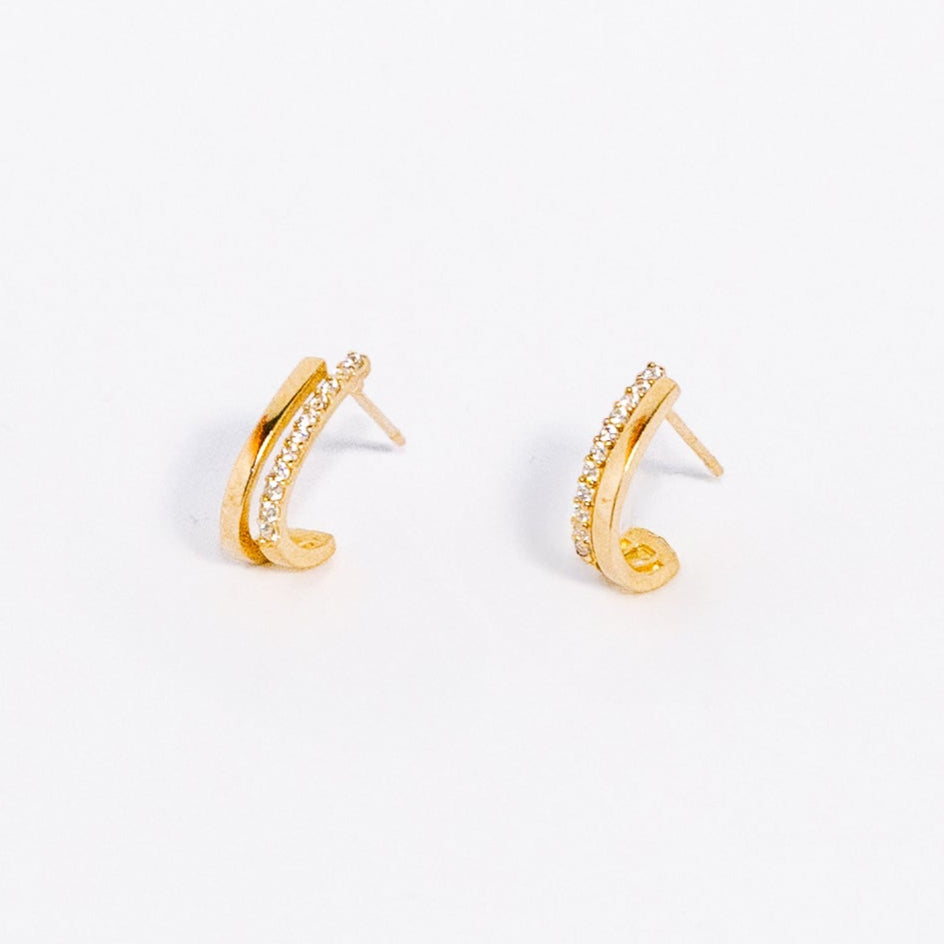Gold hoop earrings on a white background