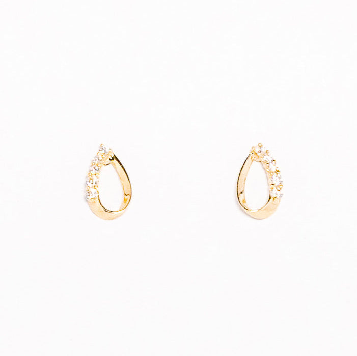 Gold hoop earrings on a white background
