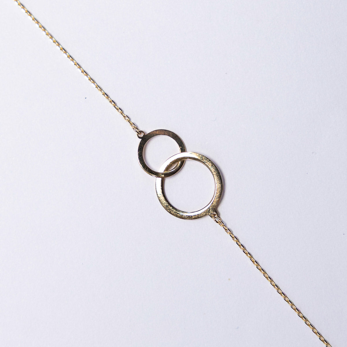 Necklace with interlocking rings on a white background