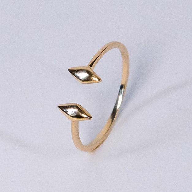 Gap ring with a minimalist design on a light gray background