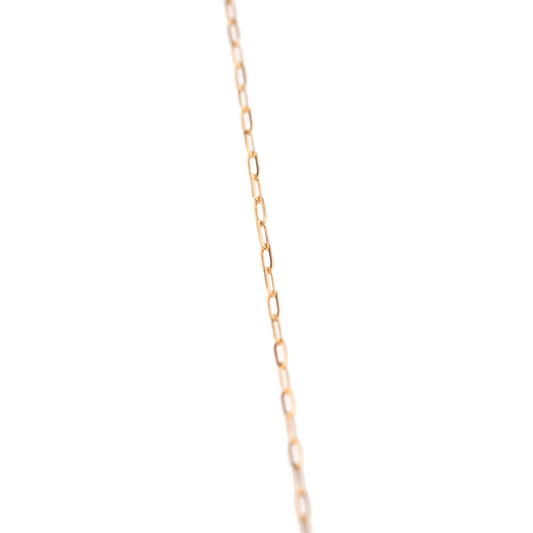 Rose gold chain necklace on a white background