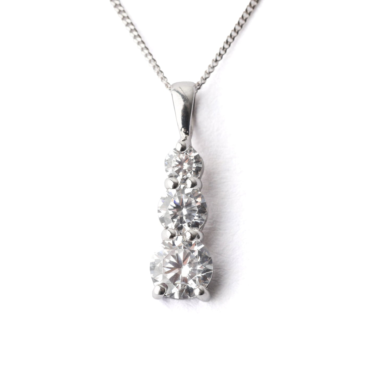 Women's 9K while gold and cubic zirconia pendant necklace on a white background