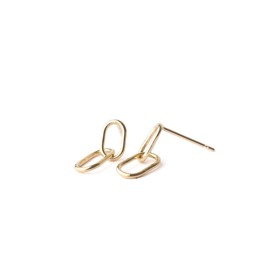 A pair of women's solid gold paperclip drop earrings on a white background