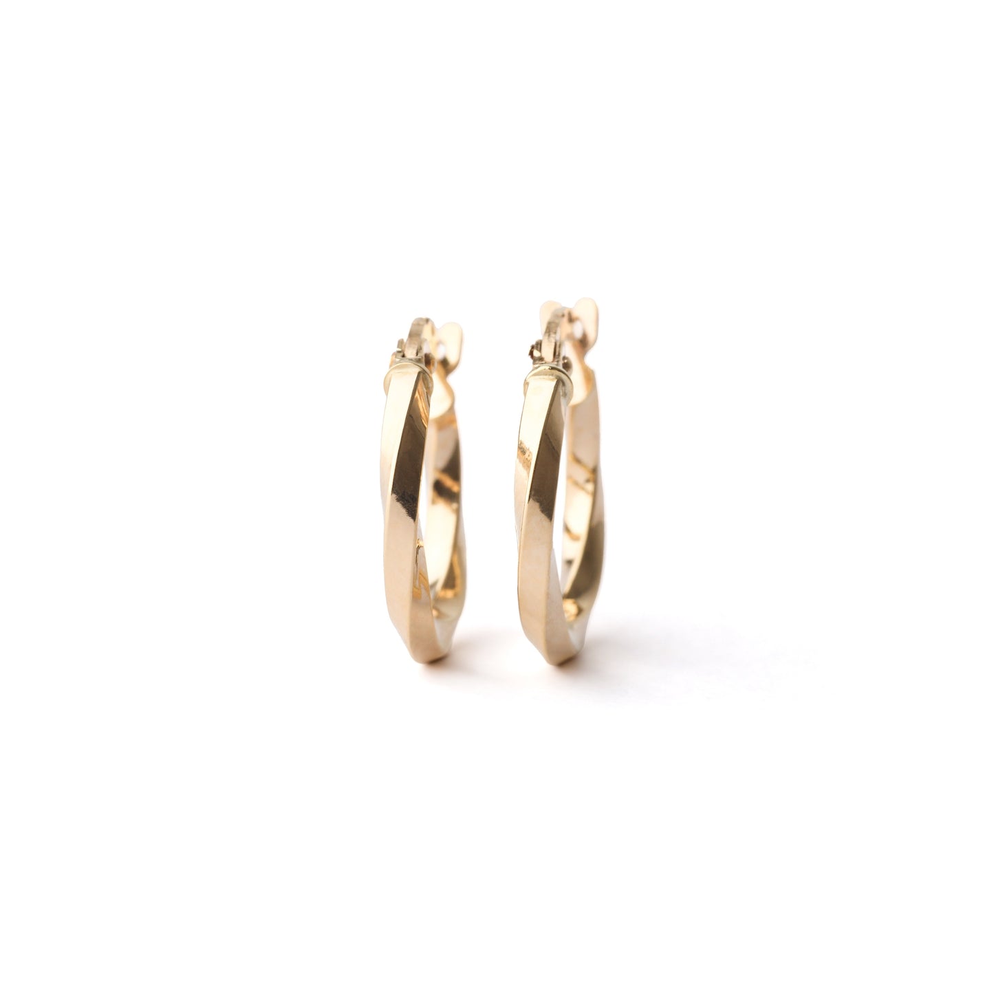 A pair of women's small 10mm solid gold twisted hoop earrings on a white background