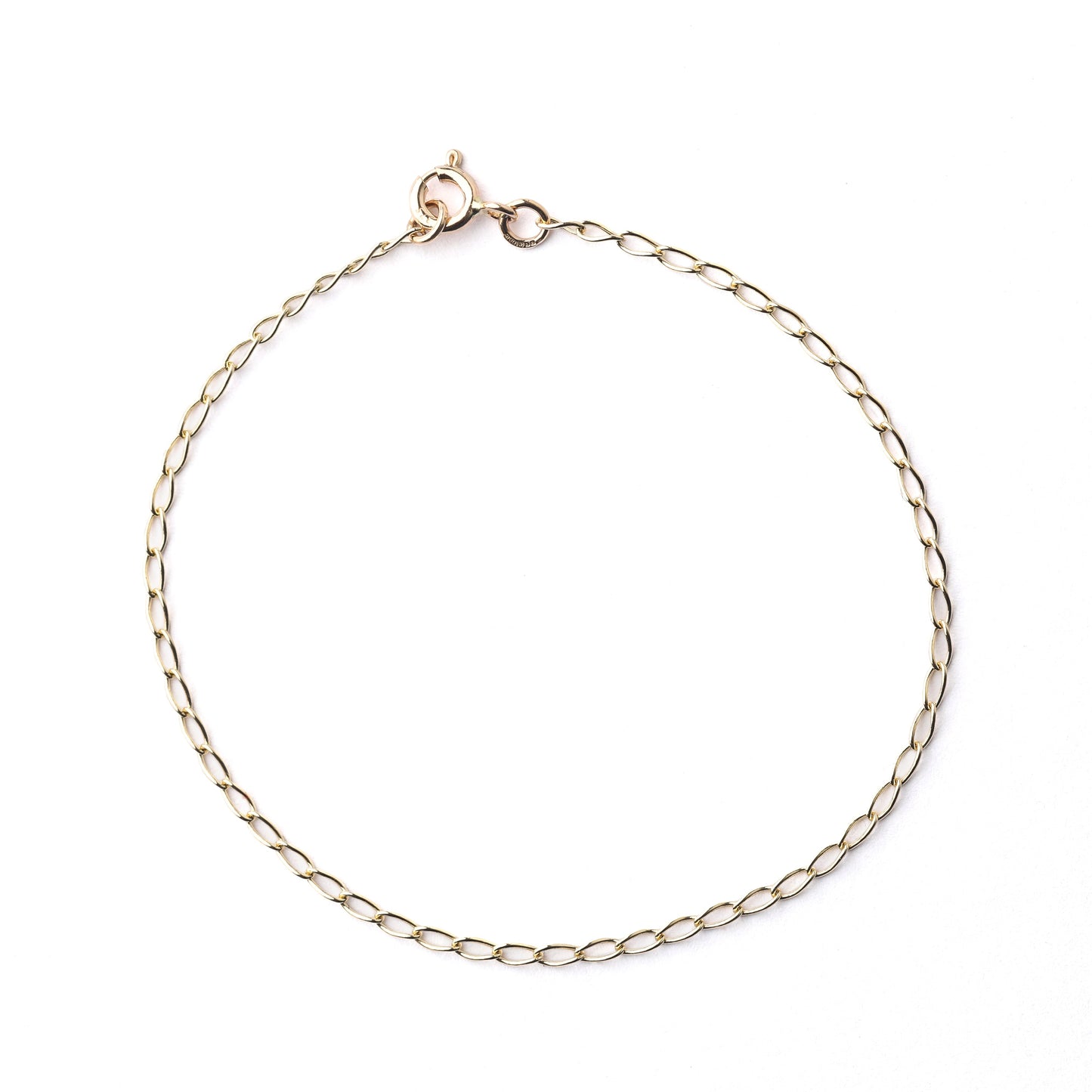 Women's 9K solid yellow gold 2mm curb chain bracelet with clasp in a circle on a white background