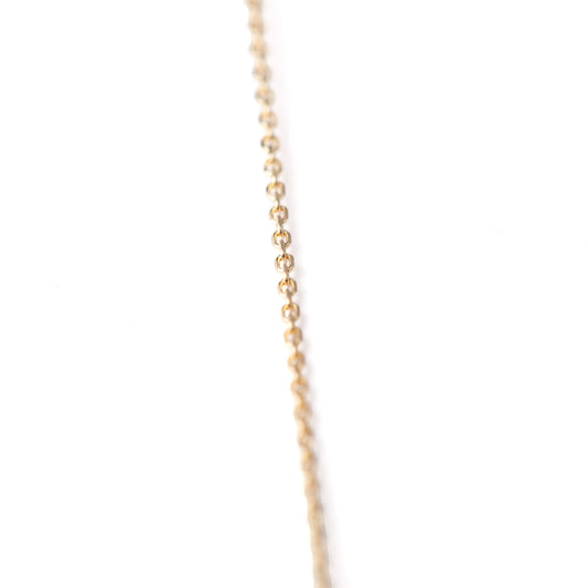 Women's 10K solid yellow gold thin link chain bracelet on a white background