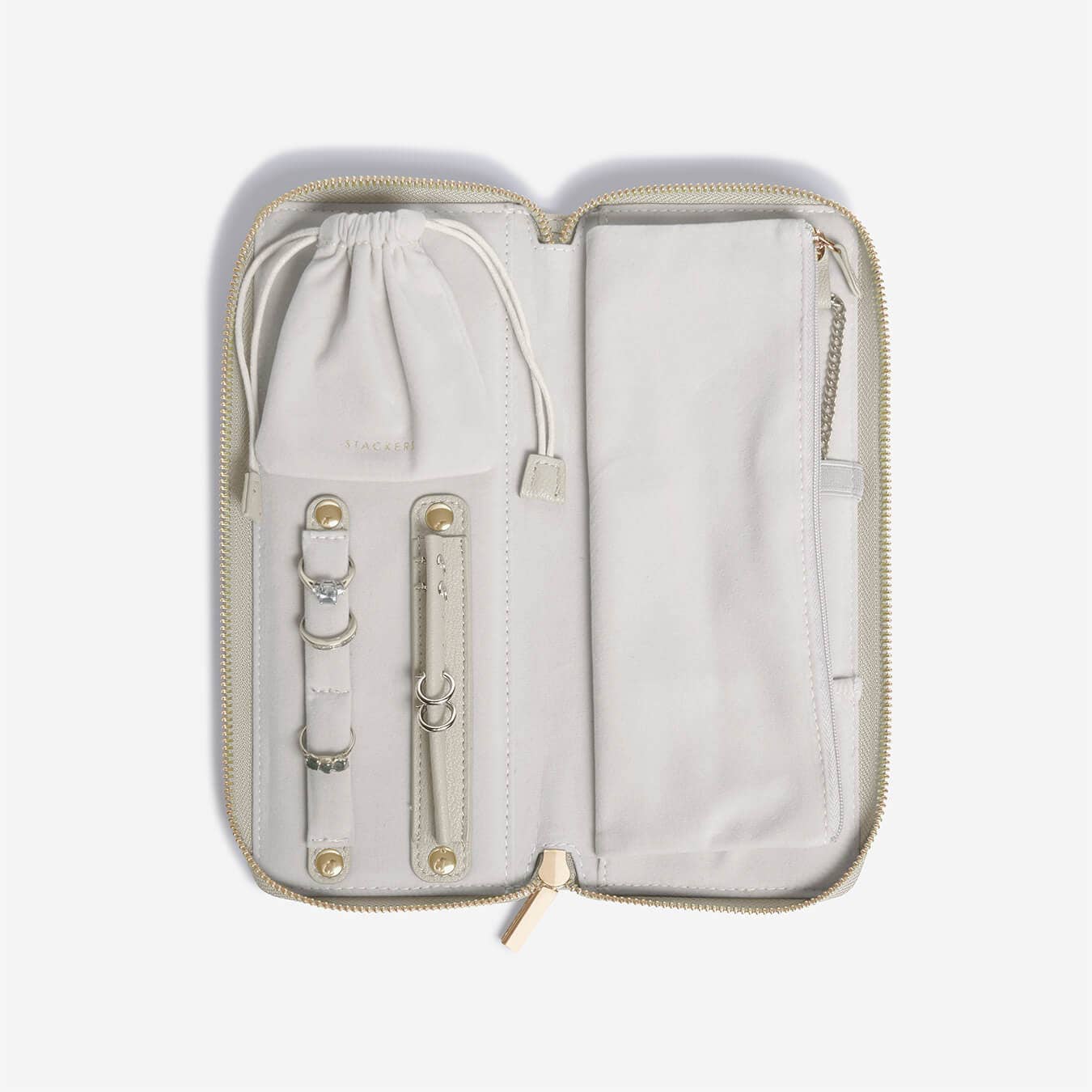 Light gray jewelry travel case with drawstring on a white background