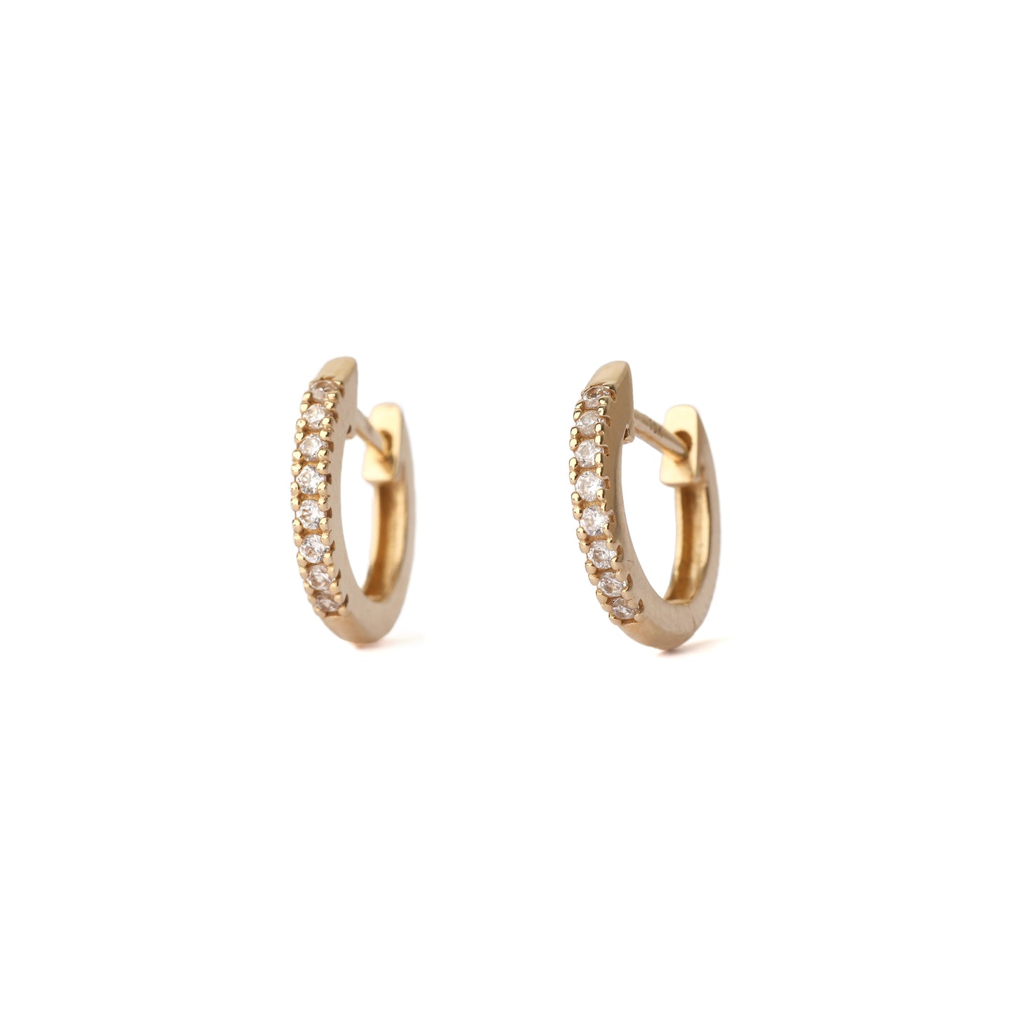 Gold hoop earrings with embedded stones on a white background