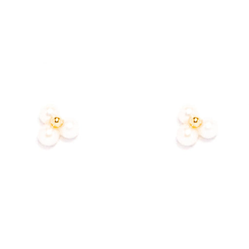 Gold earrings with white stones on a white background