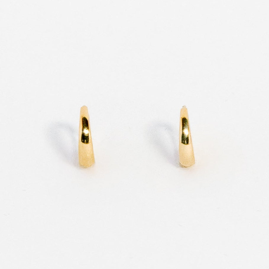 Gold hoop earrings on a white background