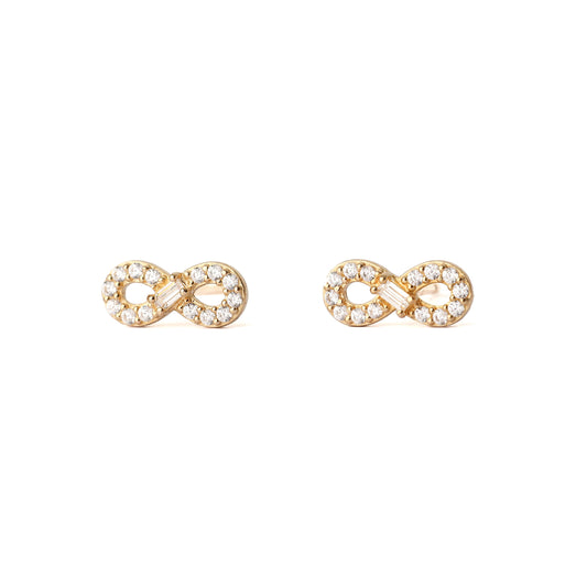 Gold infinity symbol earrings with clear stones on a white background