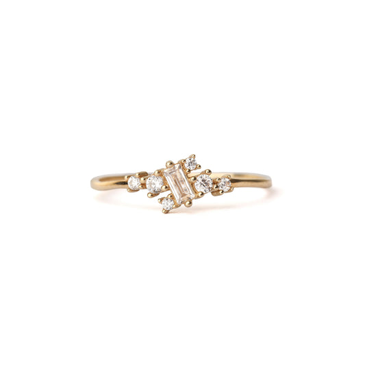 Gold ring with diamonds on a white background