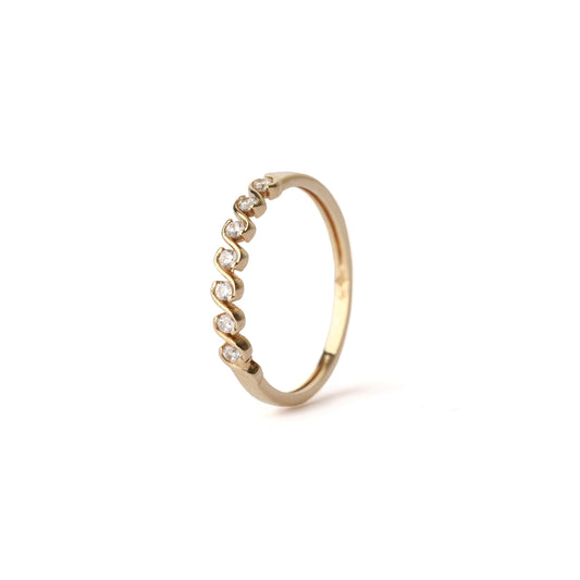 Gold ring with small diamonds on a white background