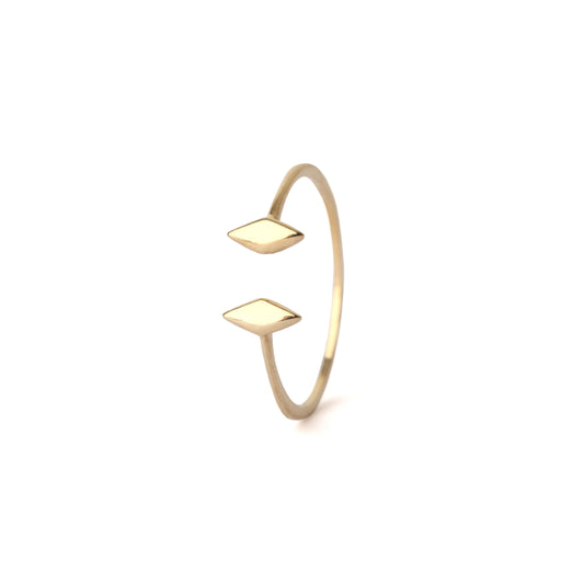 Gold open ring with square designs on a white background