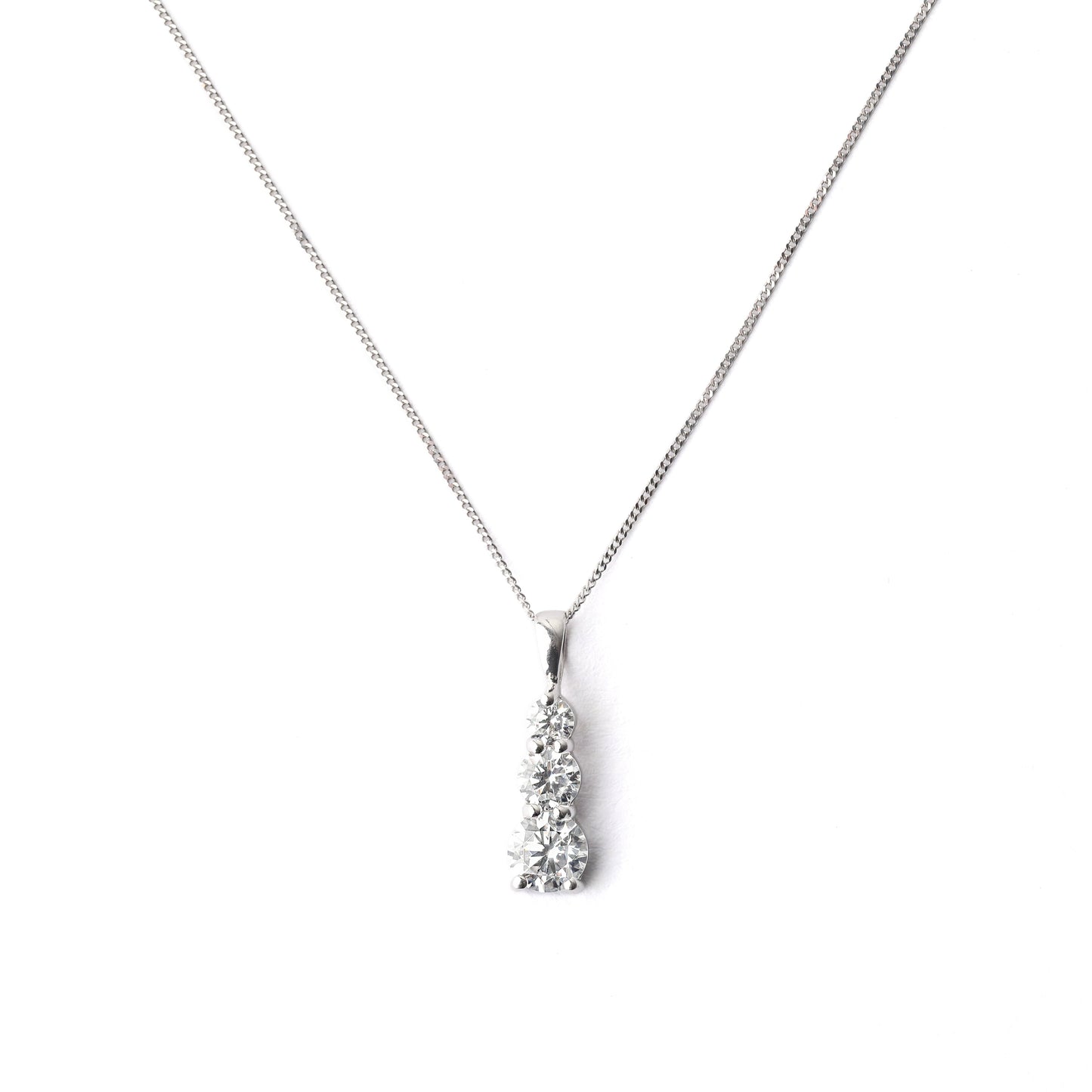 Women's 9K solid white gold chain and pendant necklace set with three cubic zirconia on a white background