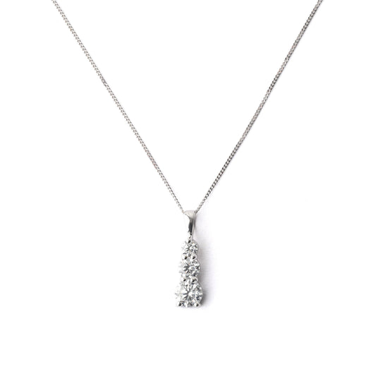 Women's 9K solid white gold chain and pendant necklace set with three cubic zirconia on a white background