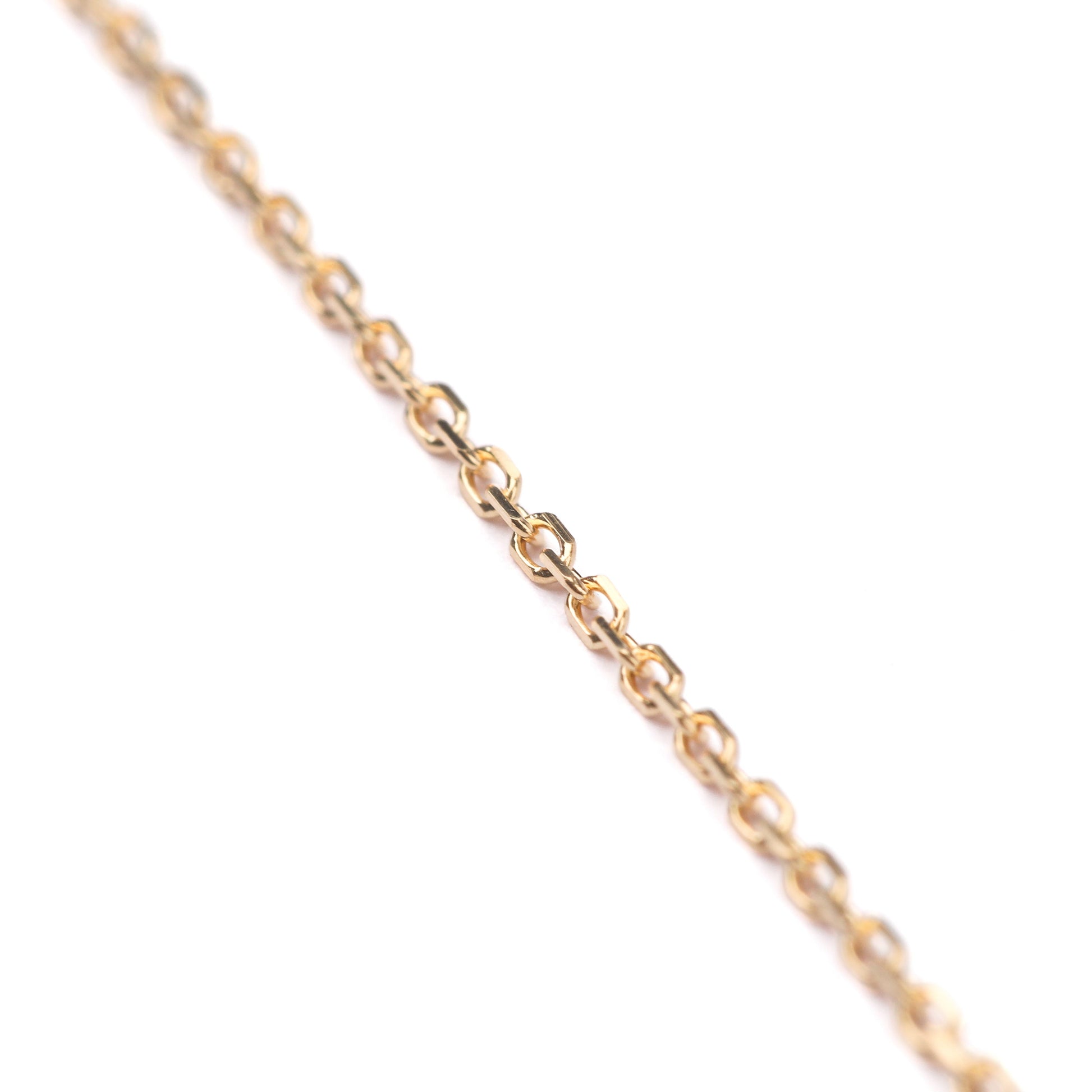 Women's 9K solid yellow gold diamond cut cable chain on a white background 