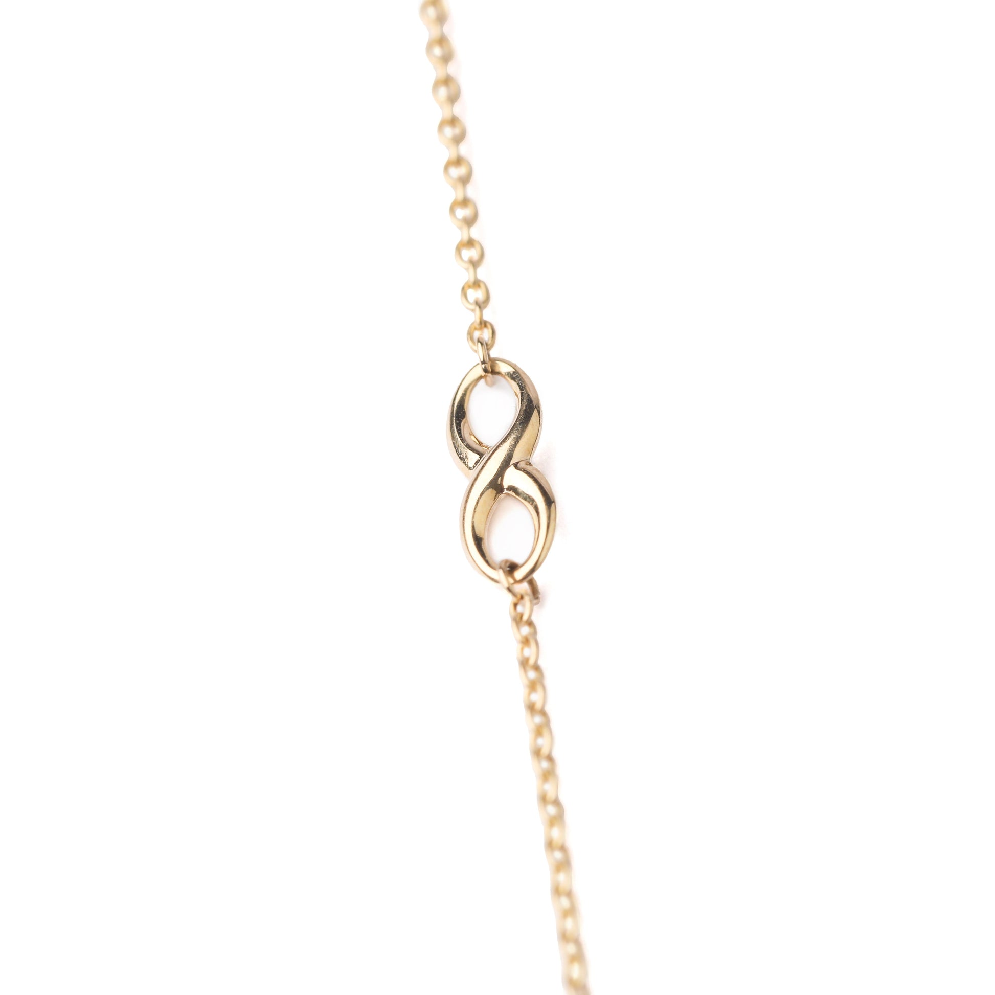 Women's 9K solid yellow gold bracelet with infinity symbol in the chain on a white background