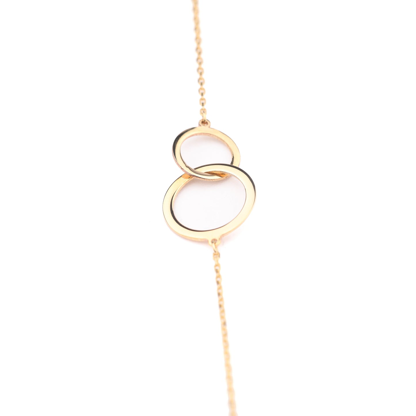 Women's 9K solid yellow gold link bracelet featuring two interlocking circles on a white background