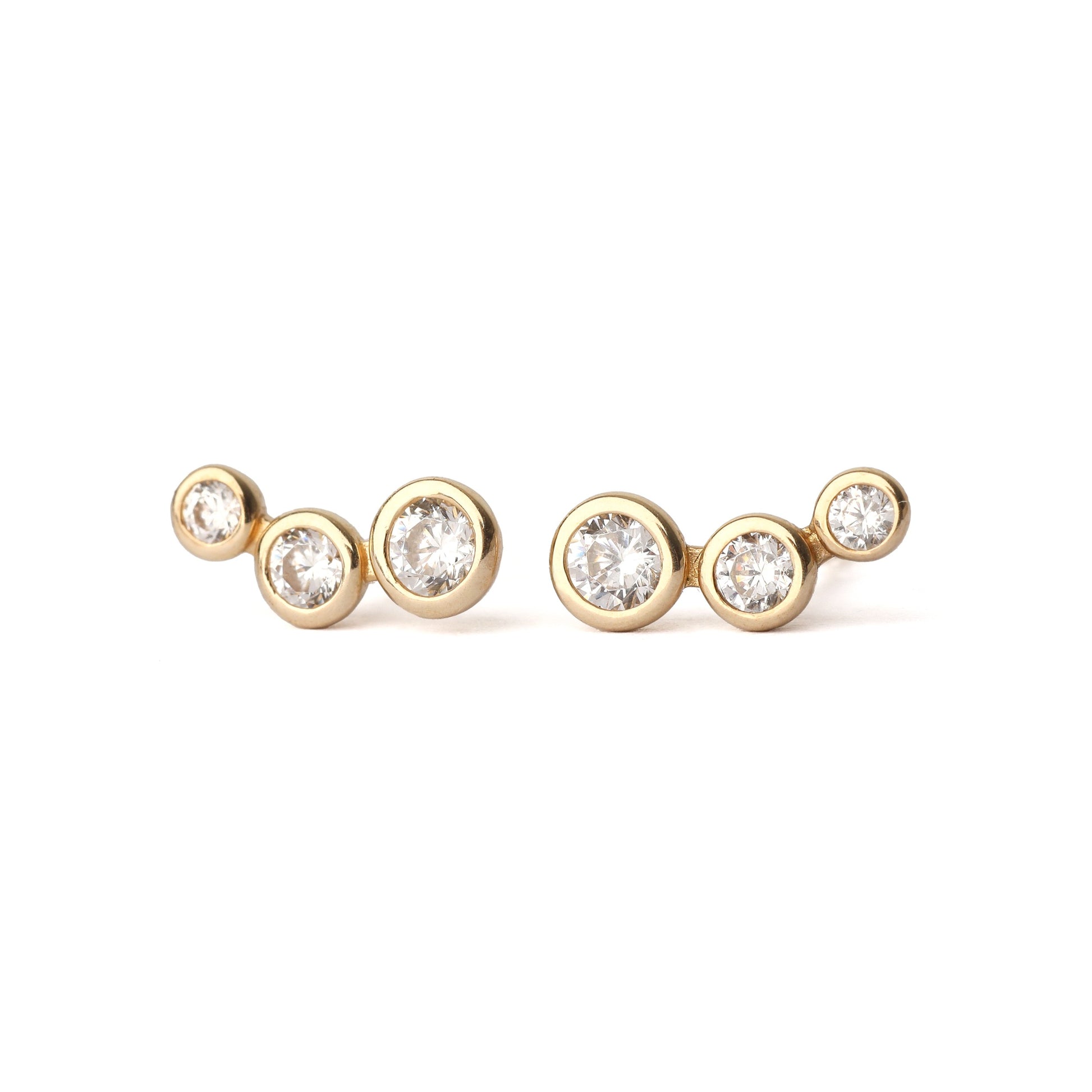A pair of women's solid gold earrings, each with three cubic zirconia gemstones in a bezel setting. The earrings are on a white background, both facing forward for the shopper to see.