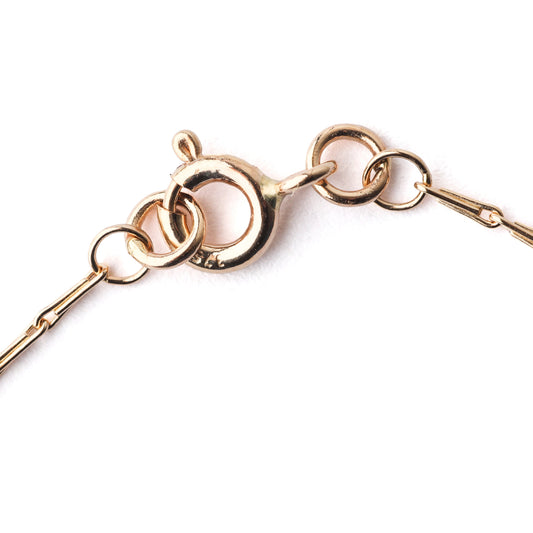 Rose gold bracelet with interlocking rings on a white background