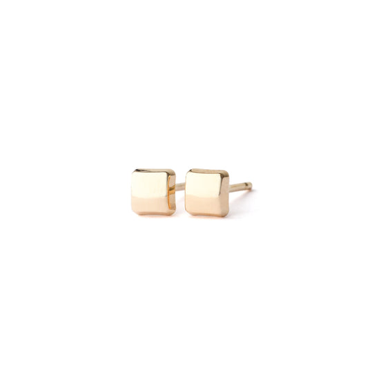 Pair of gold square stud earrings on a white background