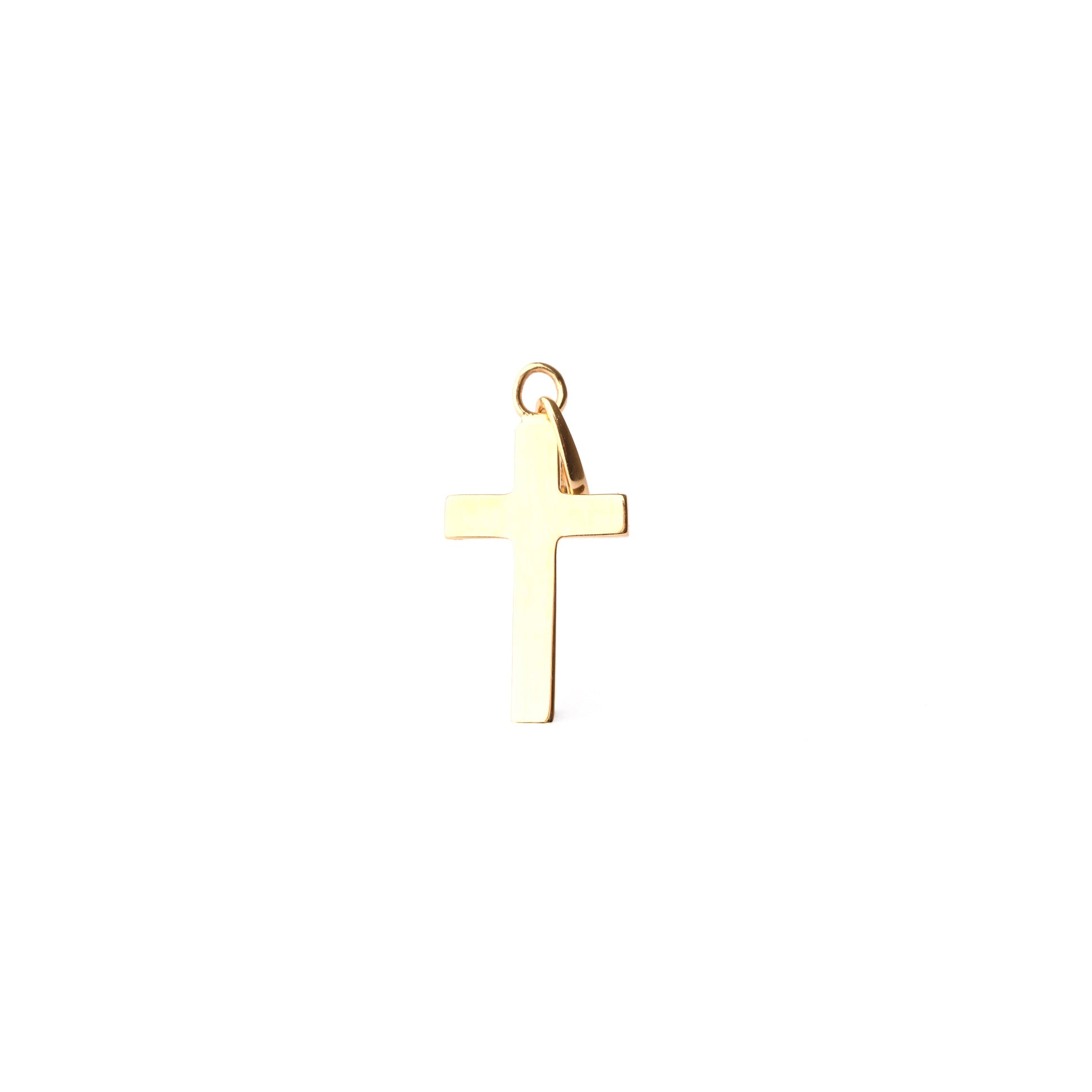 Gold cross pendant on a white background