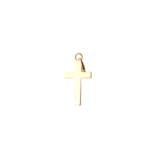 Gold cross pendant on a white background