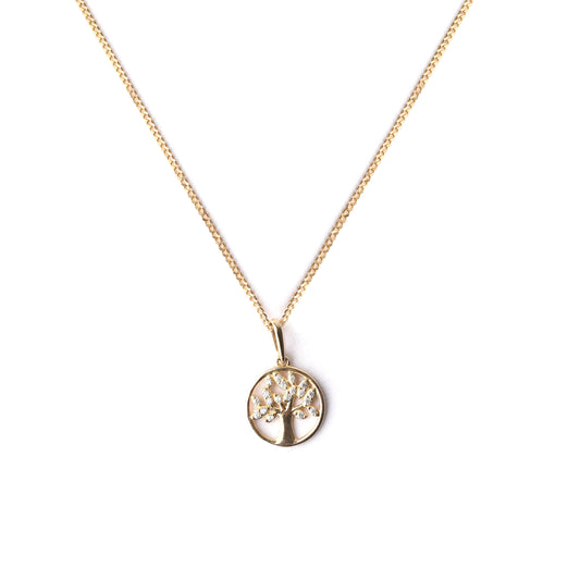 Gold necklace with a tree pendant on a white background