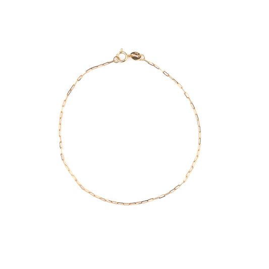 Gold bracelet on a white background