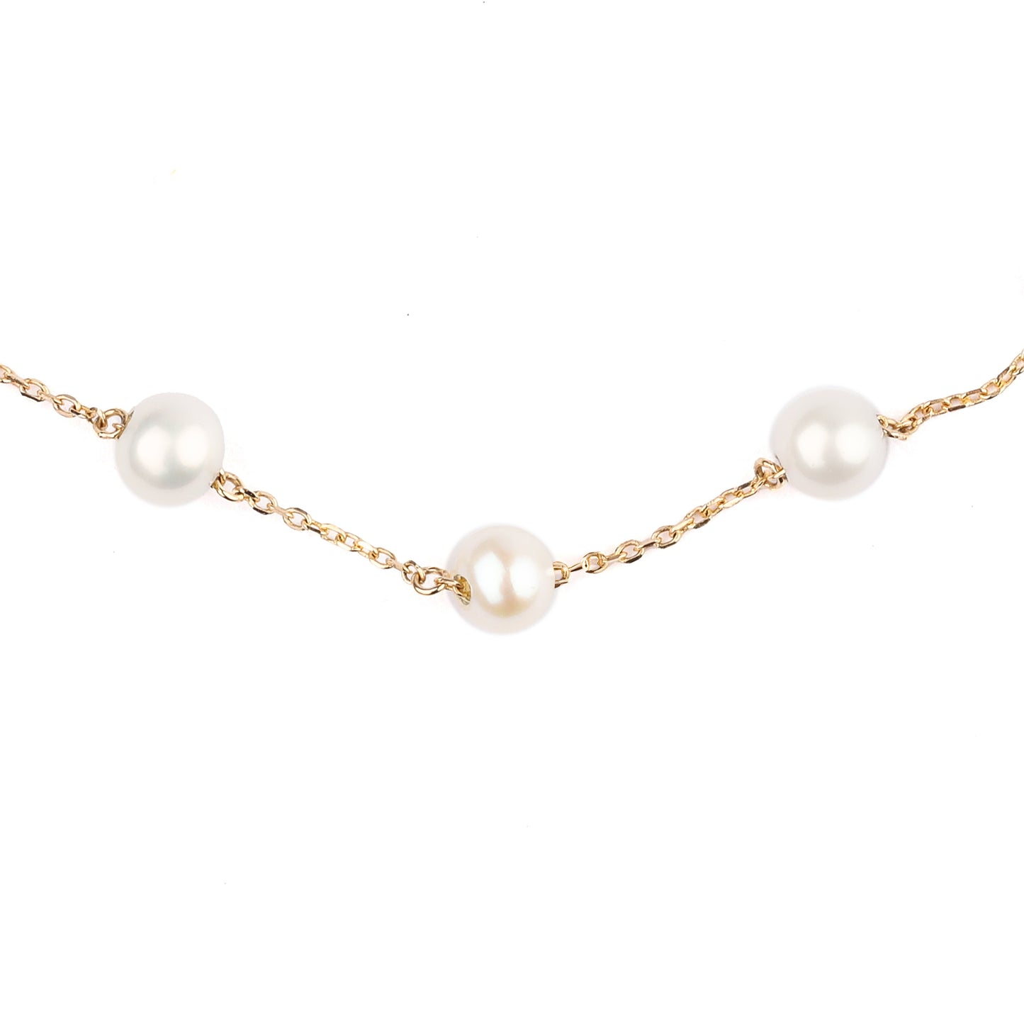 Part of a women's solid yellow gold chain bracelet decorated with three freshwater pearls displayed on a white background