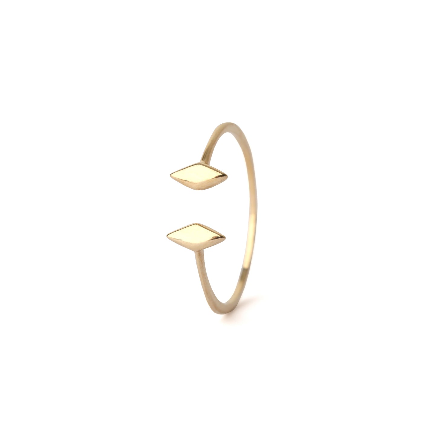Women's solid yellow gold gap ring with diamond shape ends displayed on a white background