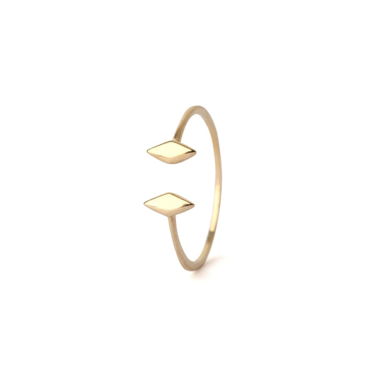 Women's solid yellow gold gap ring with diamond shape ends displayed on a white background