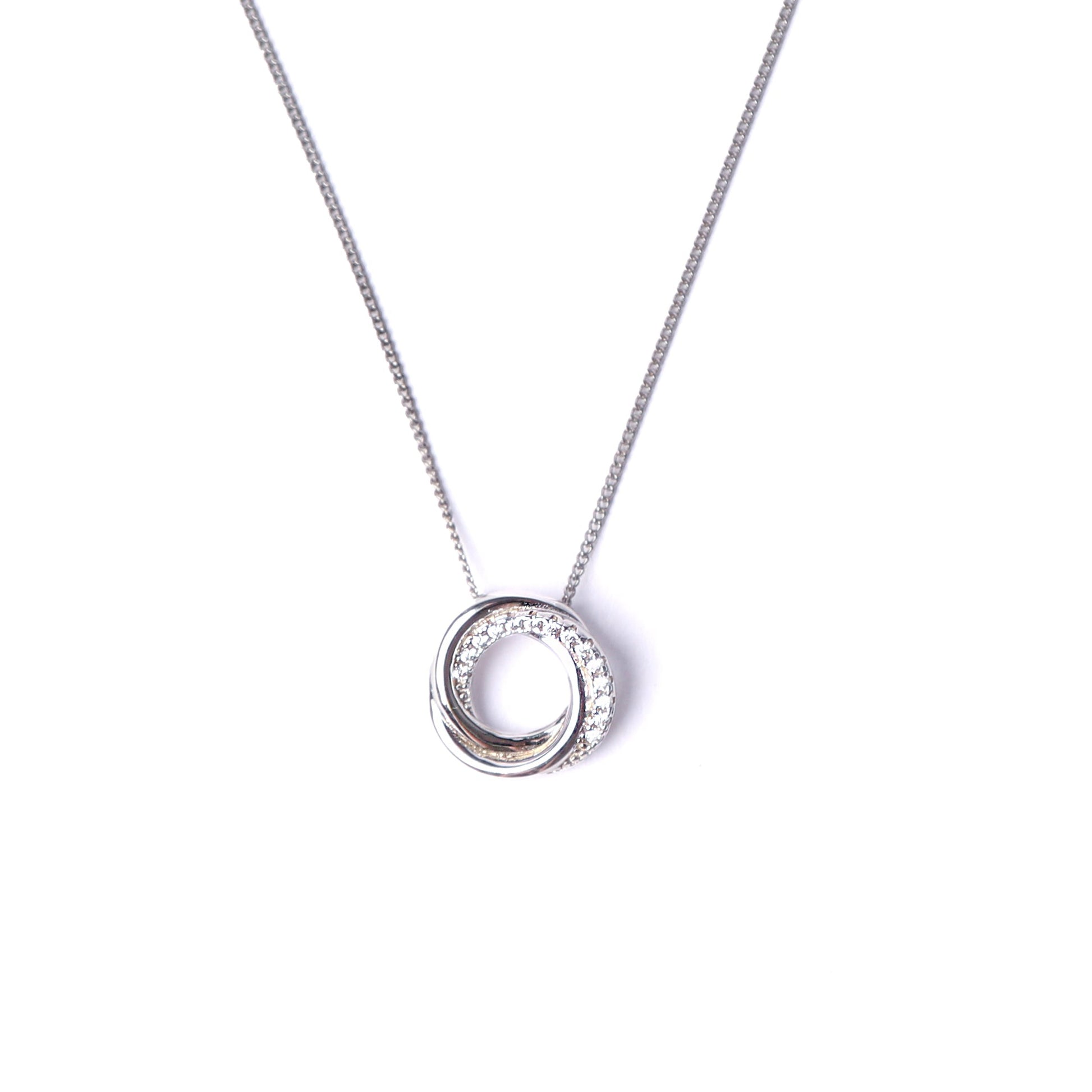 Women's sterling silver necklace set with cubic zirconia gemstones on an interlocking circles pendant, hanging from a silver chain, all set on a white background.