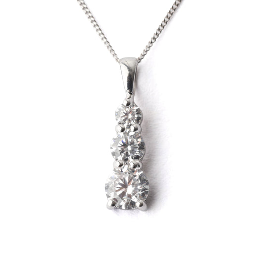 Women's 9K while gold and cubic zirconia pendant necklace on a white background