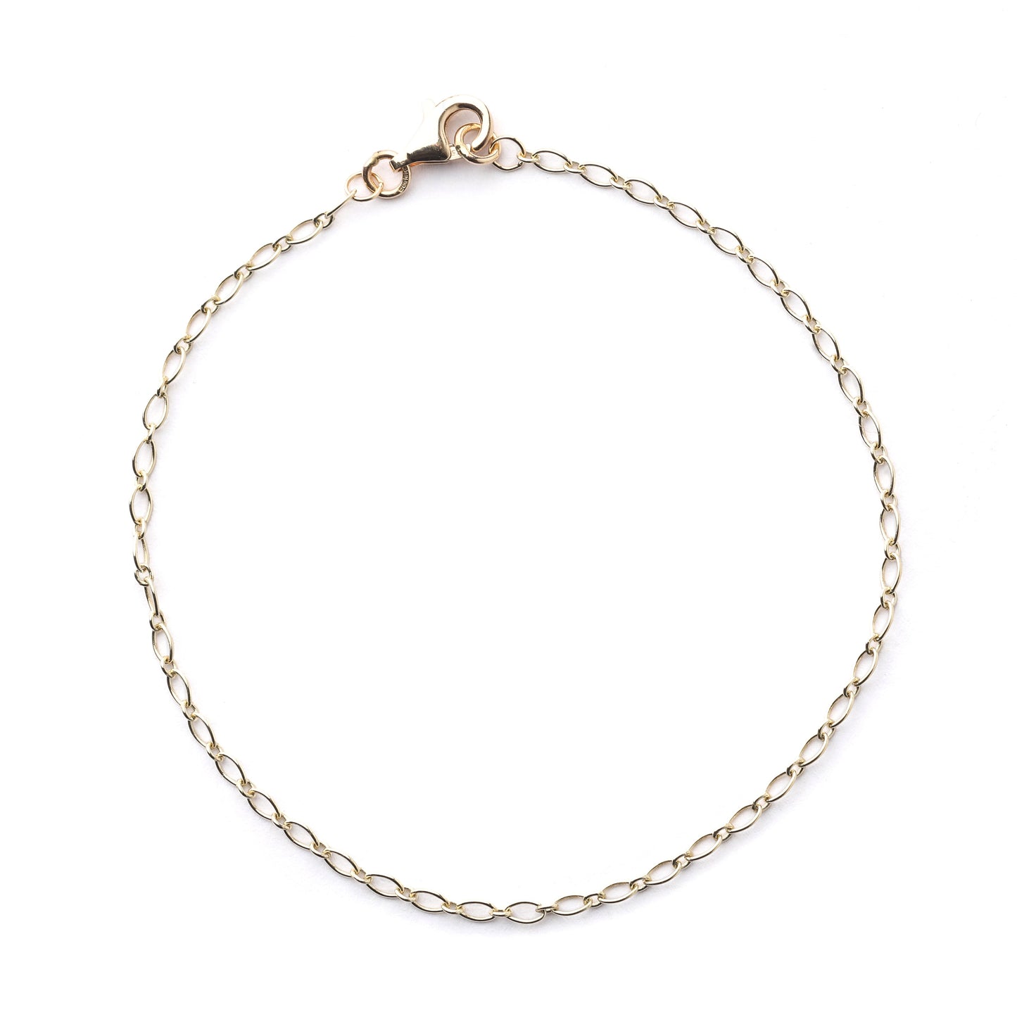 Women's 9K solid yellow gold 2mm oval trace chain bracelet with clasp in a circle on a white background