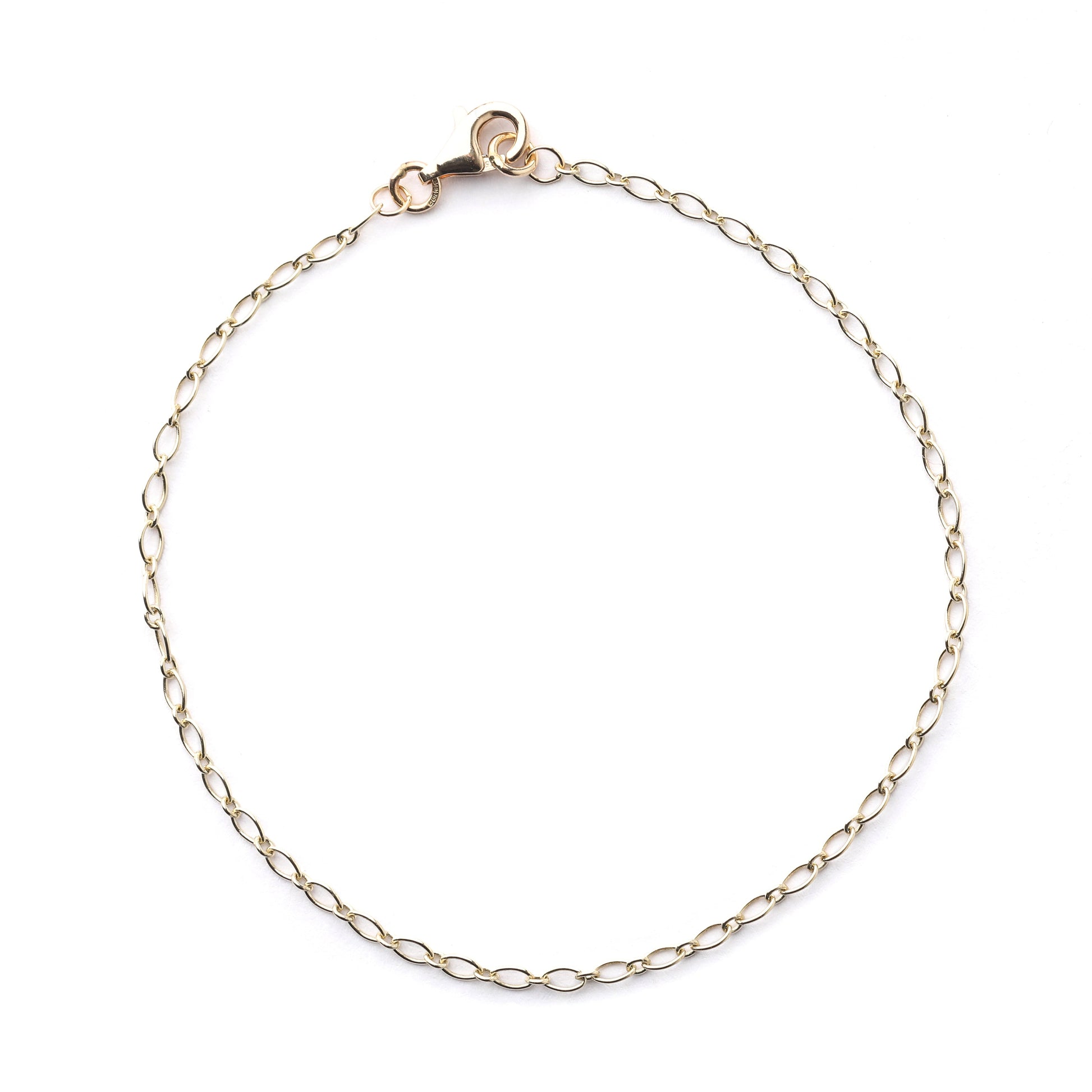 Women's 9K solid yellow gold 2mm oval trace chain bracelet with clasp in a circle on a white background