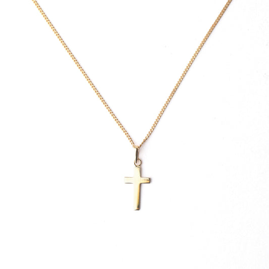 Women's 9K solid yellow gold cross pendant and necklace on a white background