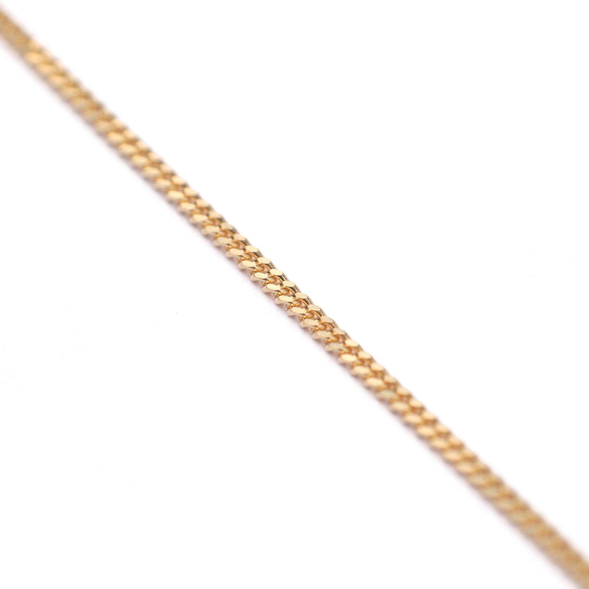 Women's 9K solid yellow gold diamond cut curb chain necklace on a white background