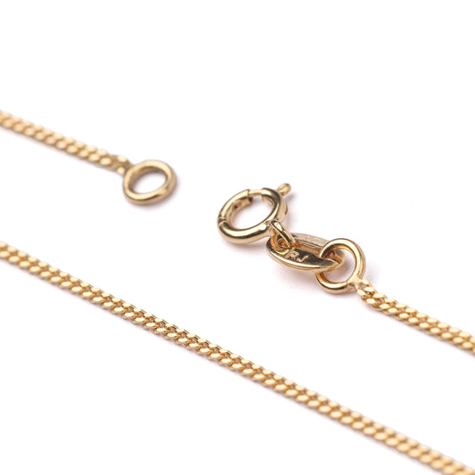 Women's 9K solid yellow gold diamond cut curb chain necklace with clasp on a white background 