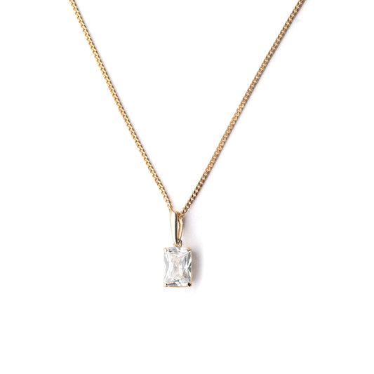 Women's solid gold and emerld-cut cubic zirconia pendant necklace with on a white background