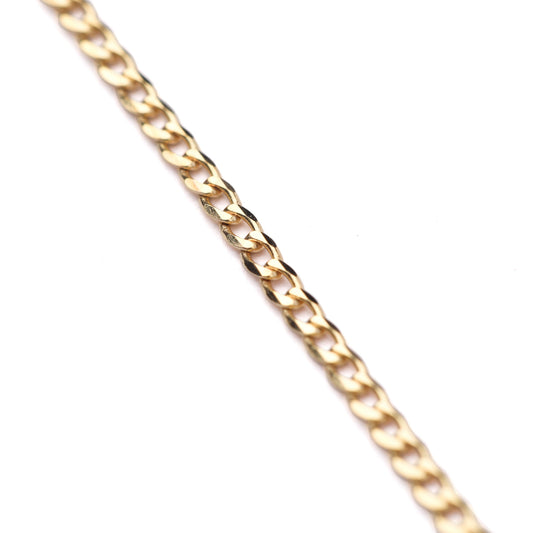 Women's 9K solid yellow gold faceted flat curb chain necklace on a white background