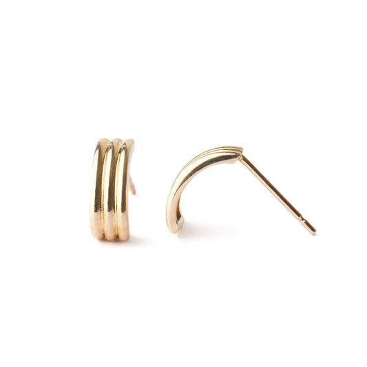 women's solid gold half hoop stud earrings on a white background