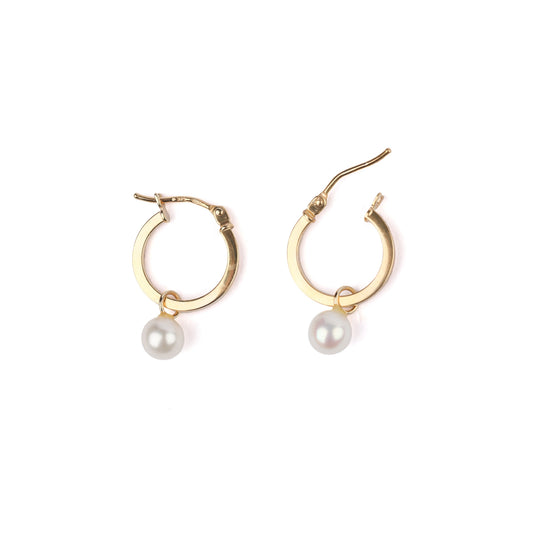 Women's solid gold hoop earrings with freshwater pearl drops on a white background