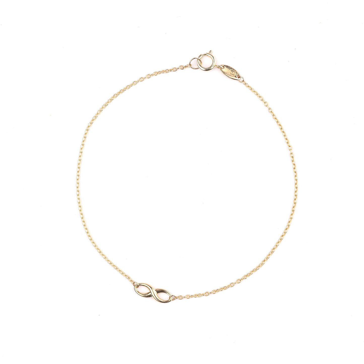 Women's 9K solid yellow gold infinity bracelet on a white background
