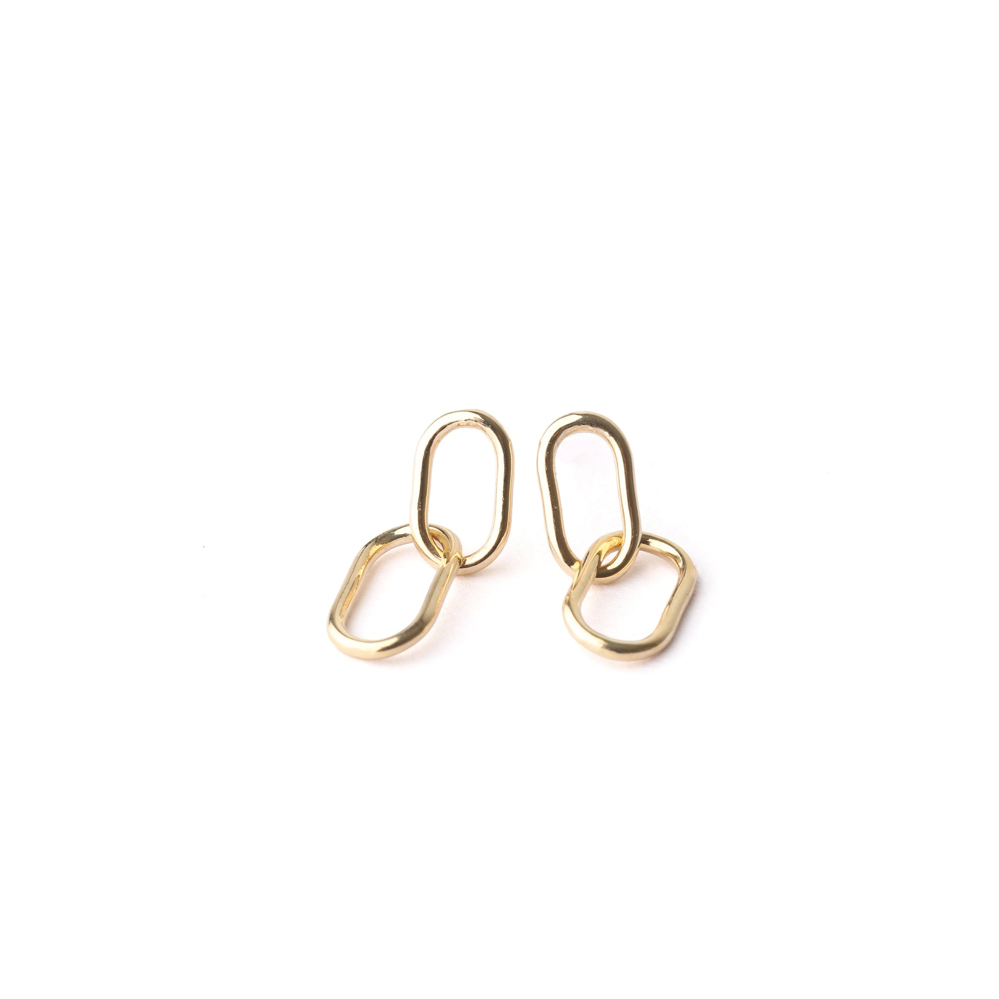 A pair of women's solid gold paperclip drop earrings on a white background