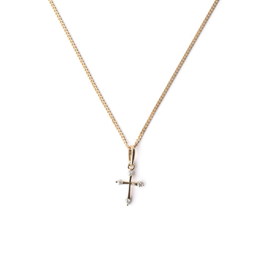 Women's 9K solid yellow gold necklace with sparkling cubic zirconia cross pendant on a white background